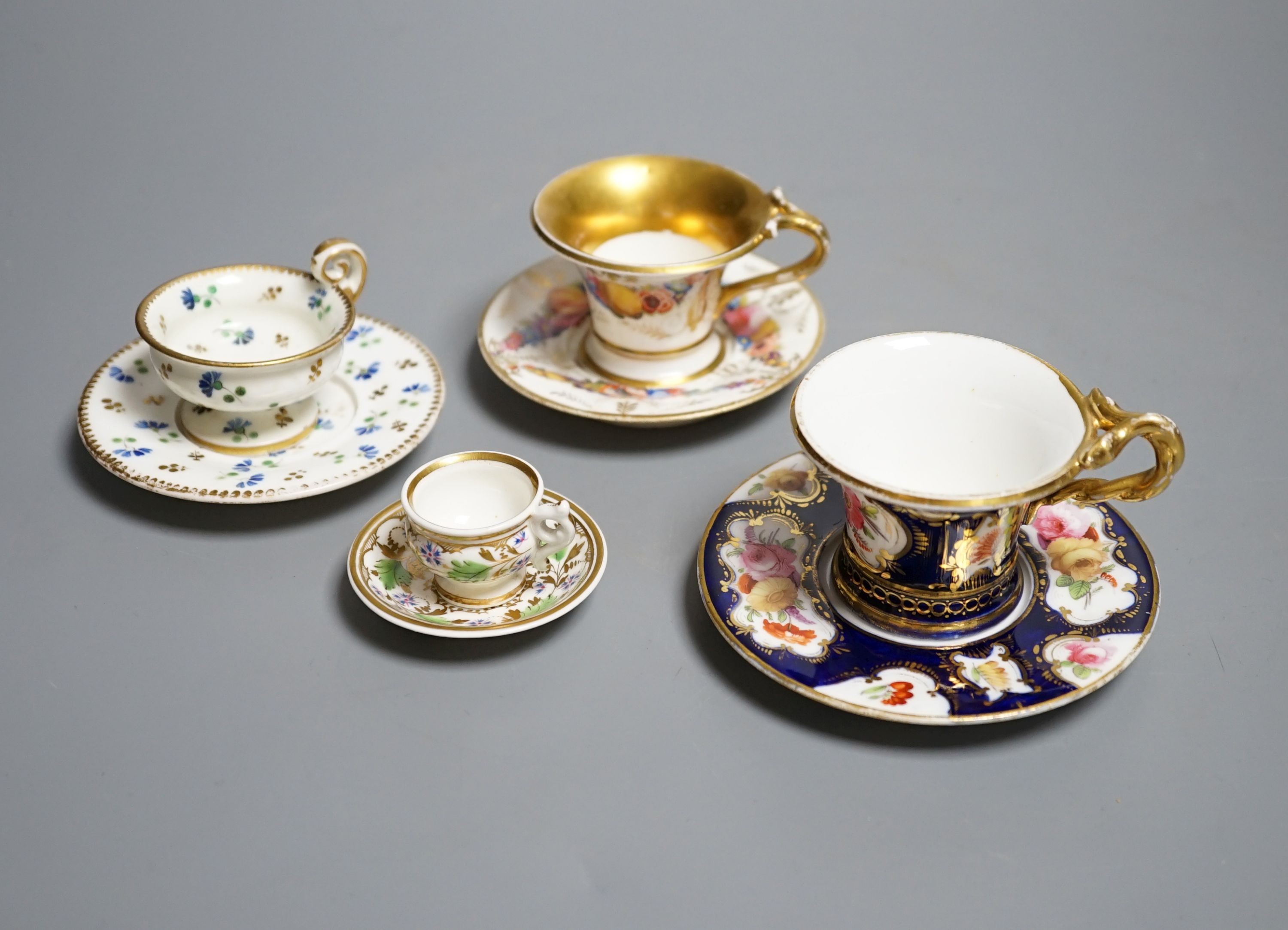 Four Coalport miniature teacups and saucers, c. 1820. Provenance - Mona Sattin collection of miniature cups and saucers, collection no.s 102, 103, 104 and 106.